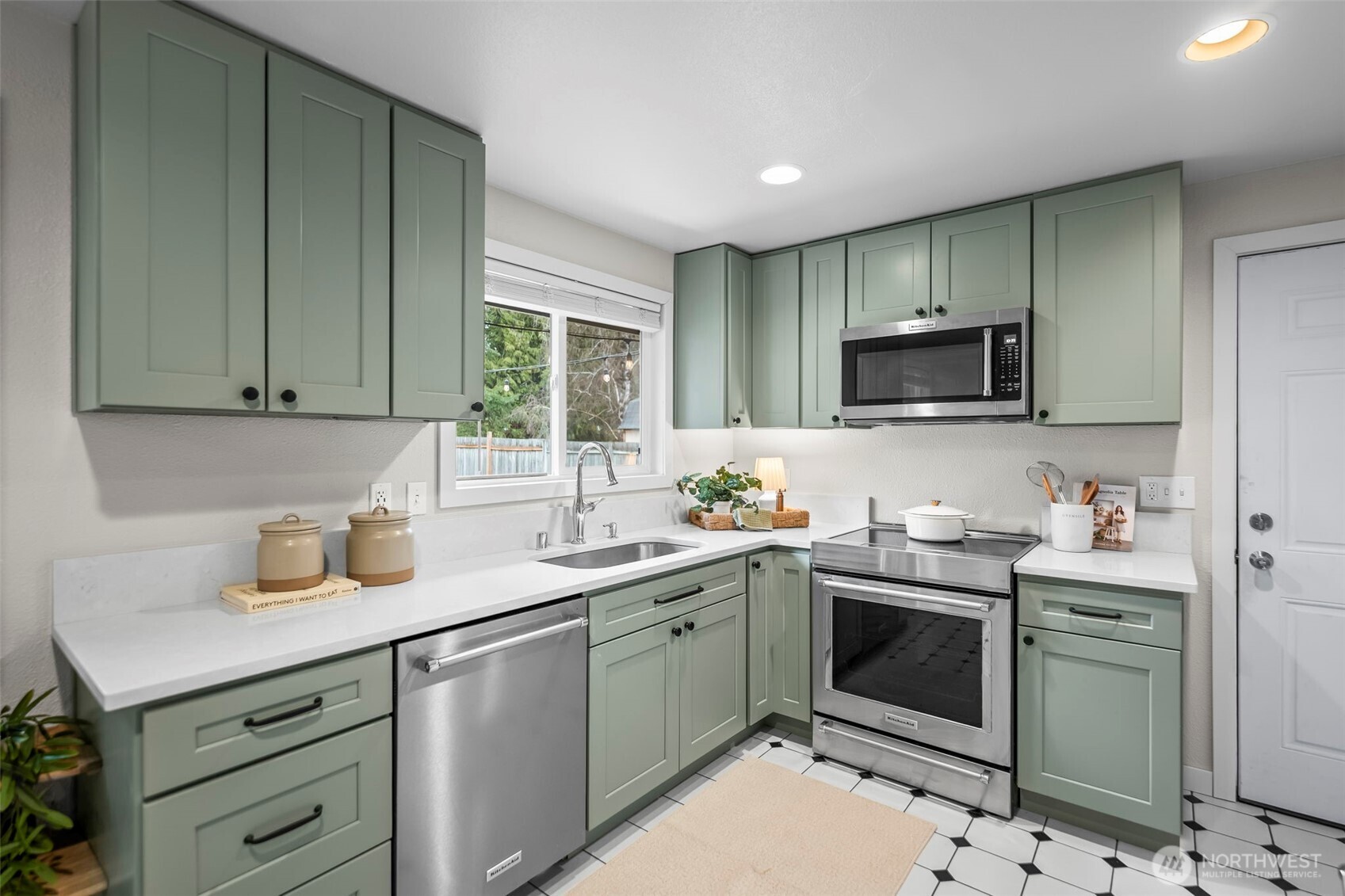 16519 116th Place Southeast Renton, WA 98058 - Photo 12 of 28 a kitchen with a sink stove and microwave