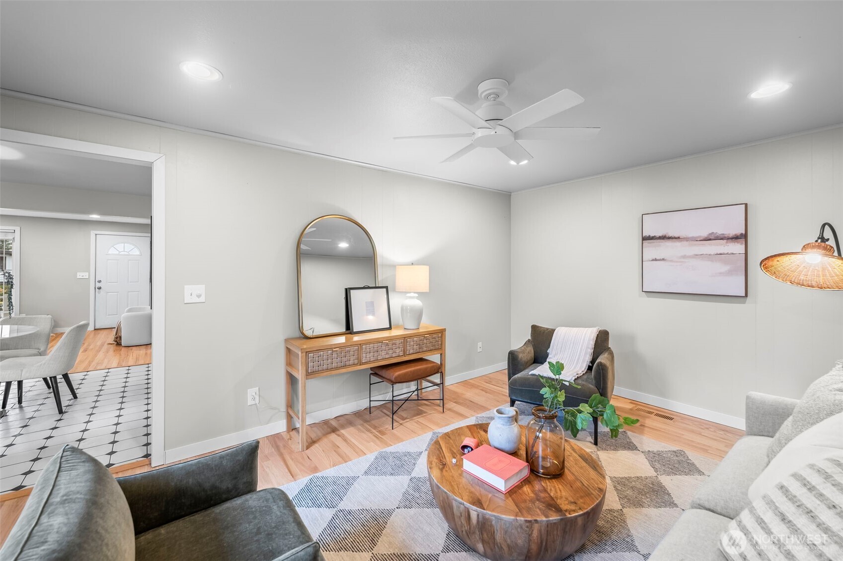 16519 116th Place Southeast Renton, WA 98058 - Photo 14 of 28 a living room with furniture and a mirror