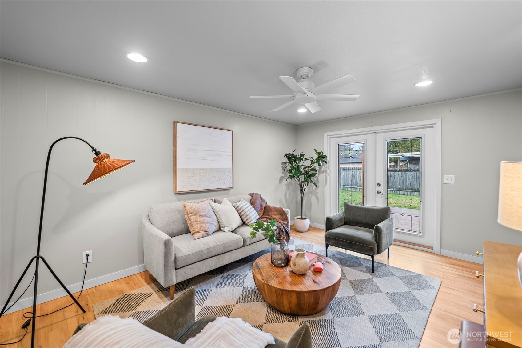 16519 116th Place Southeast Renton, WA 98058 - Photo 17 of 28 a living room with furniture a rug and a chandelier