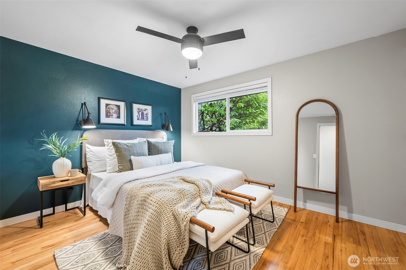 16519 116th Place Southeast Renton, WA 98058 - Photo 18 of 28 a bedroom with a bed and a chandelier