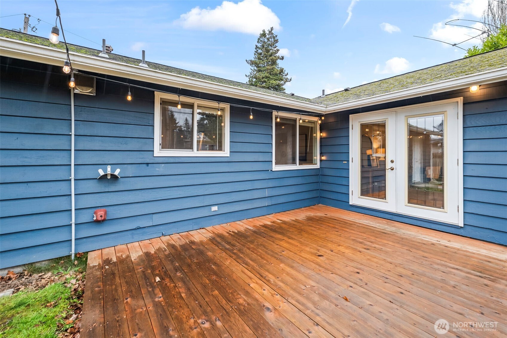 16519 116th Place Southeast Renton, WA 98058 - Photo 26 of 28 a view of house with backyard and wooden floor