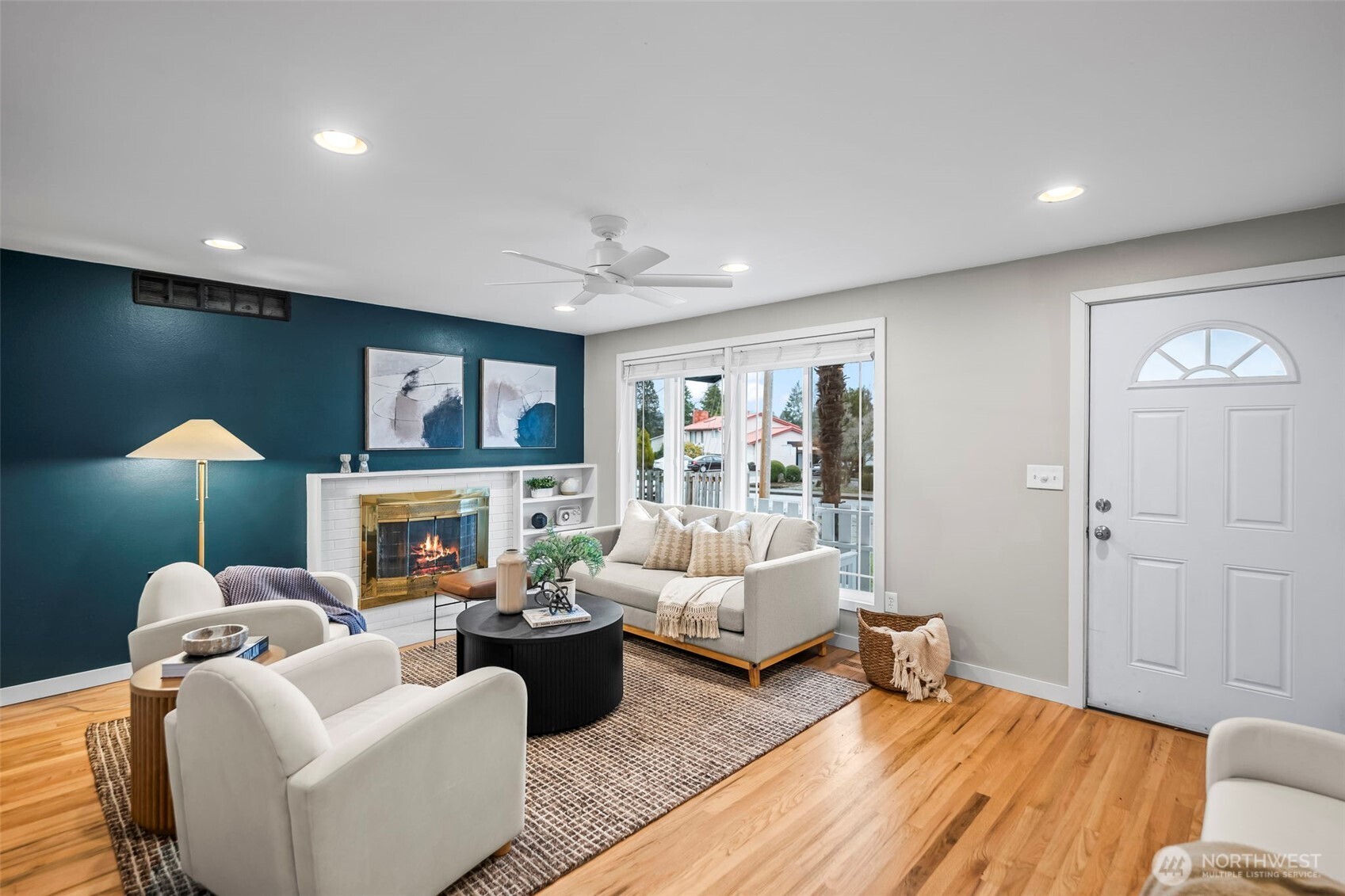 16519 116th Place Southeast Renton, WA 98058 - Photo 5 of 28 a living room with furniture and a flat screen tv