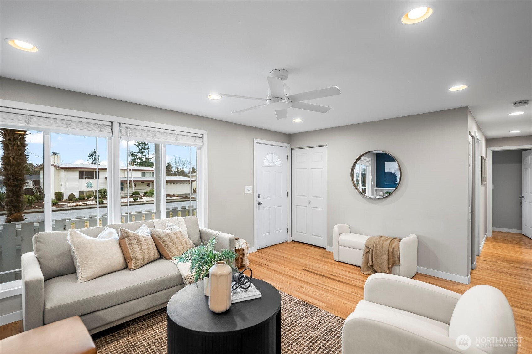 16519 116th Place Southeast Renton, WA 98058 - Photo 9 of 28 a living room with furniture and a large window