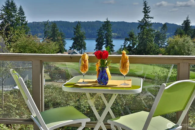 a view of a chairs and table in patio