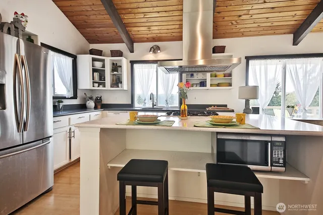 a kitchen with a sink cabinets and window