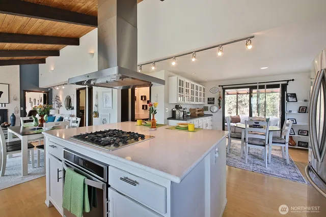 a kitchen with stainless steel appliances granite countertop a stove and a refrigerator