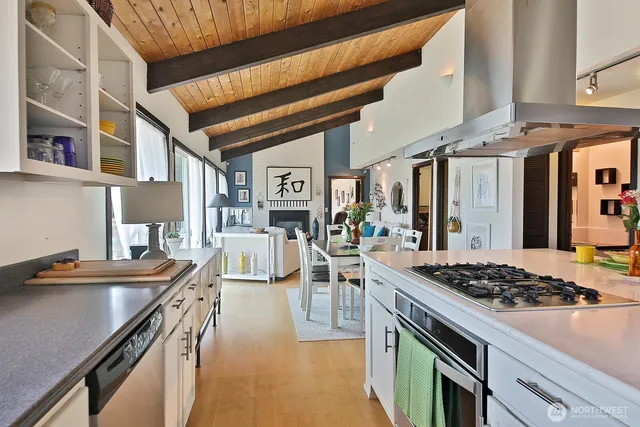a kitchen with a stove and a refrigerator