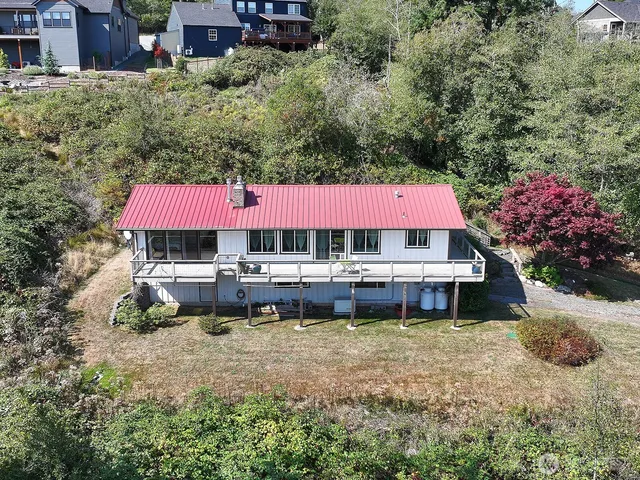 an aerial view of a house with a yard patio and a garden