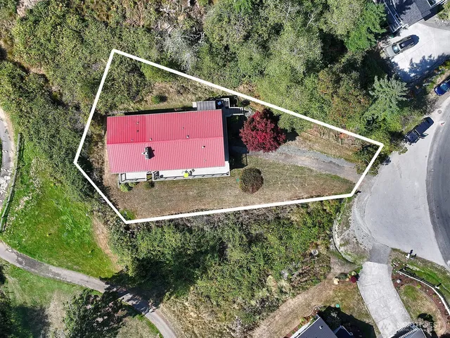 an aerial view of residential house with outdoor space and swimming pool