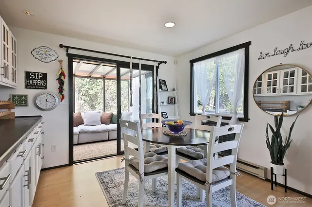 a living room with furniture a flat screen tv and a large window