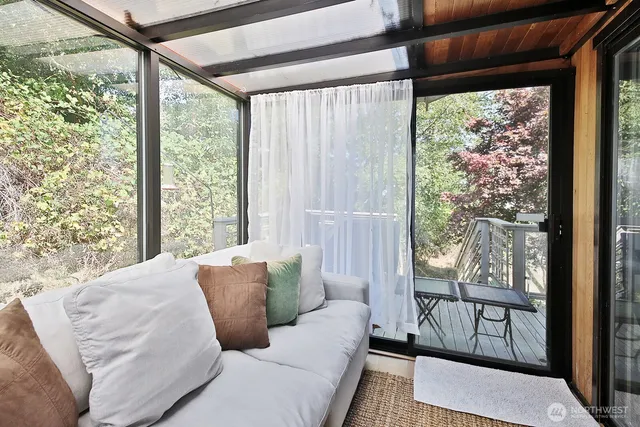 a living room with couch and a window