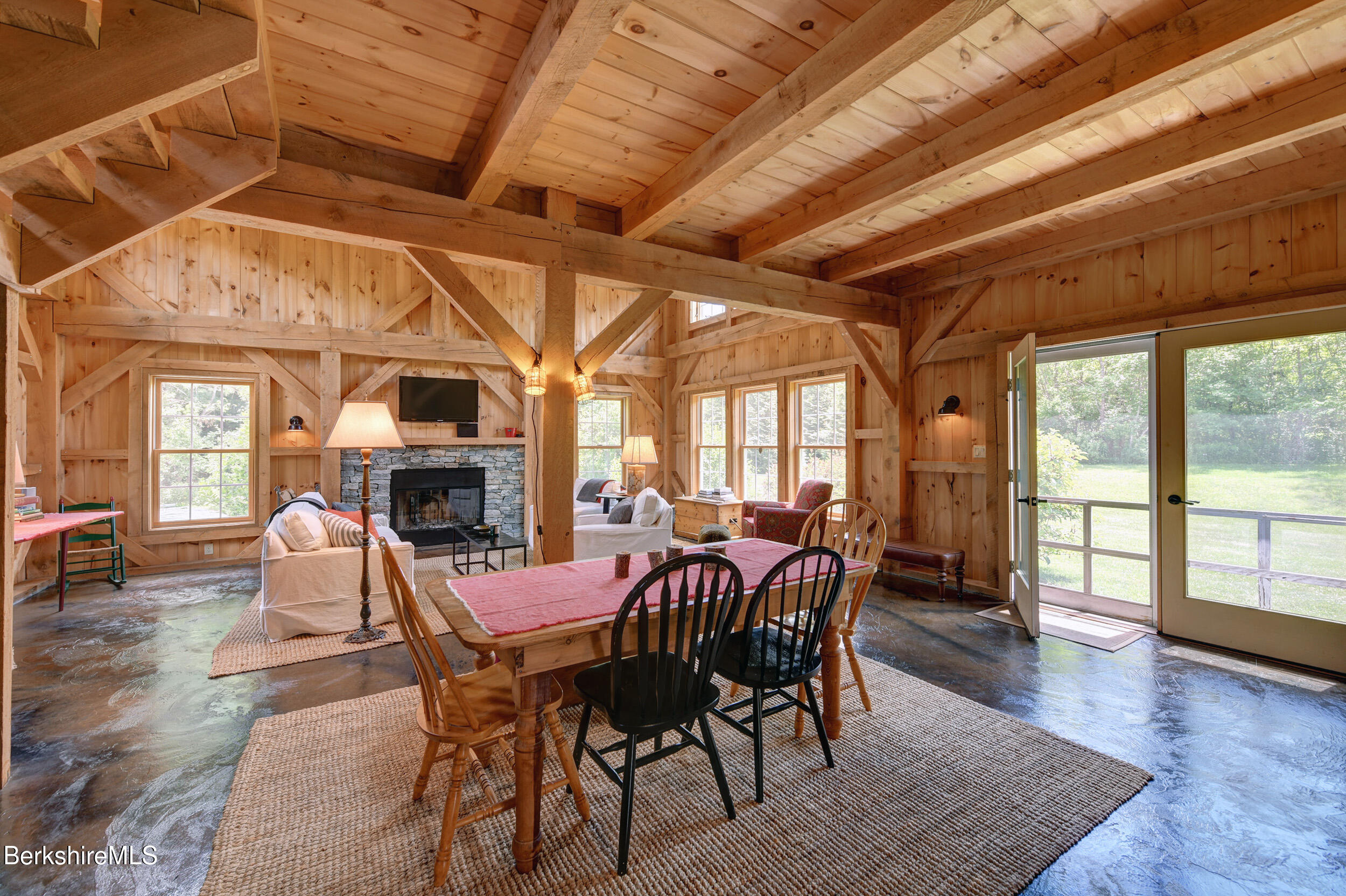 66 Access Road Becket, MA 01223 - Photo 13 of 54 a view of a dining room with furniture window and wooden floor