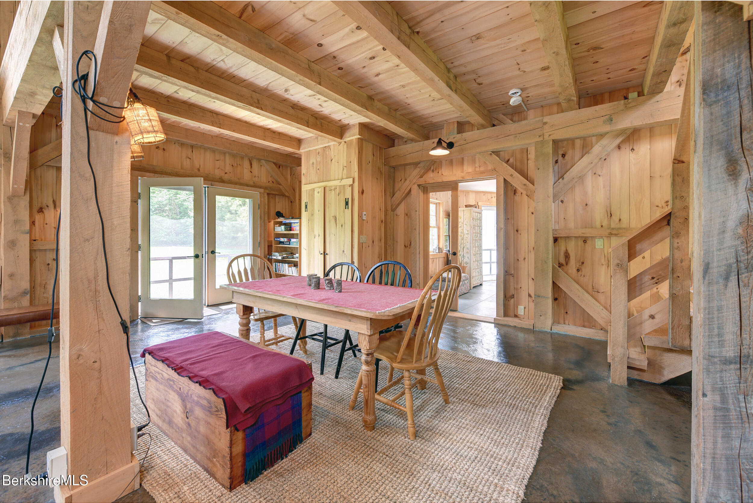 66 Access Road Becket, MA 01223 - Photo 14 of 54 a view of a dining room with furniture window and wooden floor