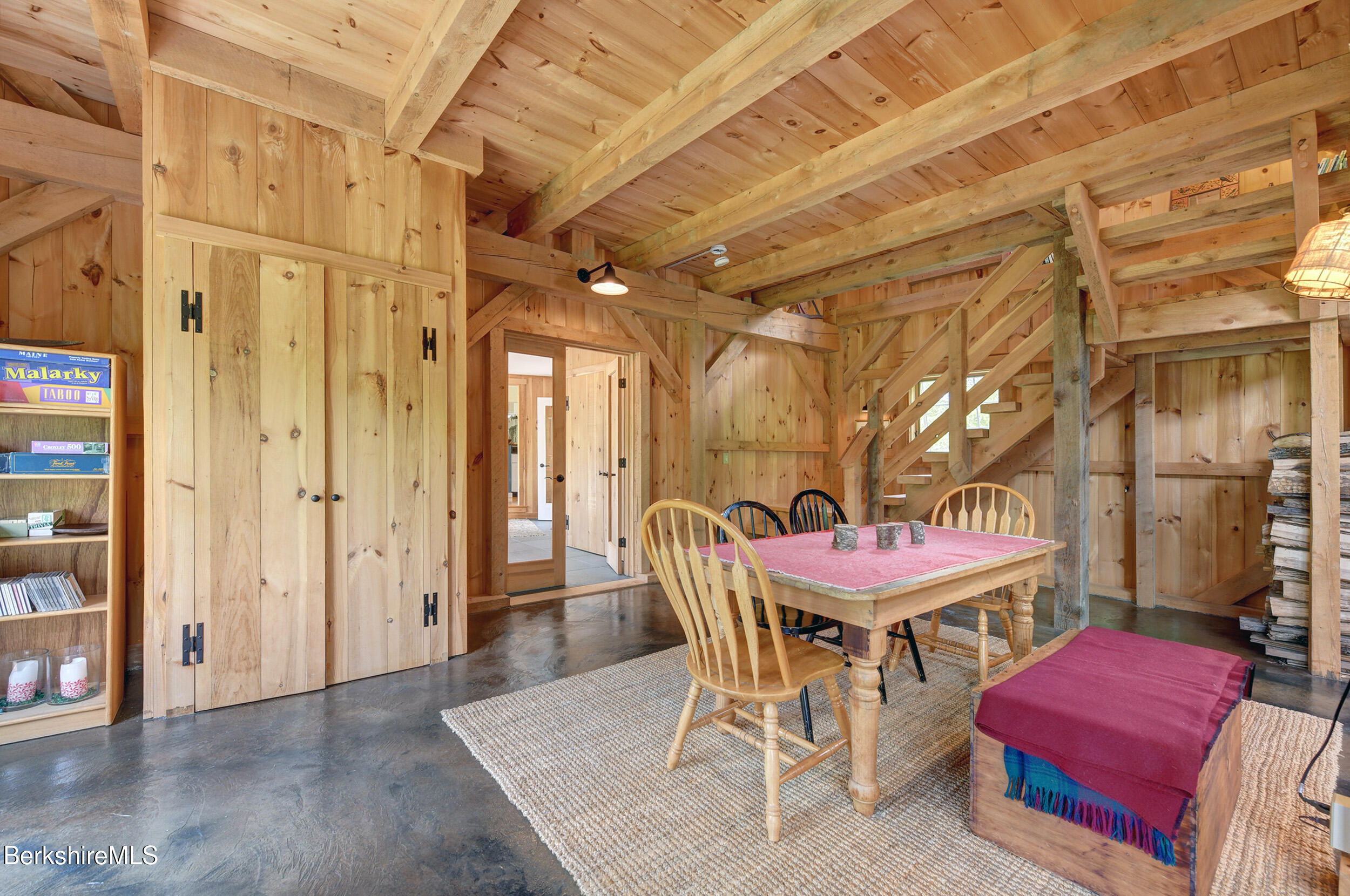 66 Access Road Becket, MA 01223 - Photo 15 of 54 a dining room with furniture and wooden floor