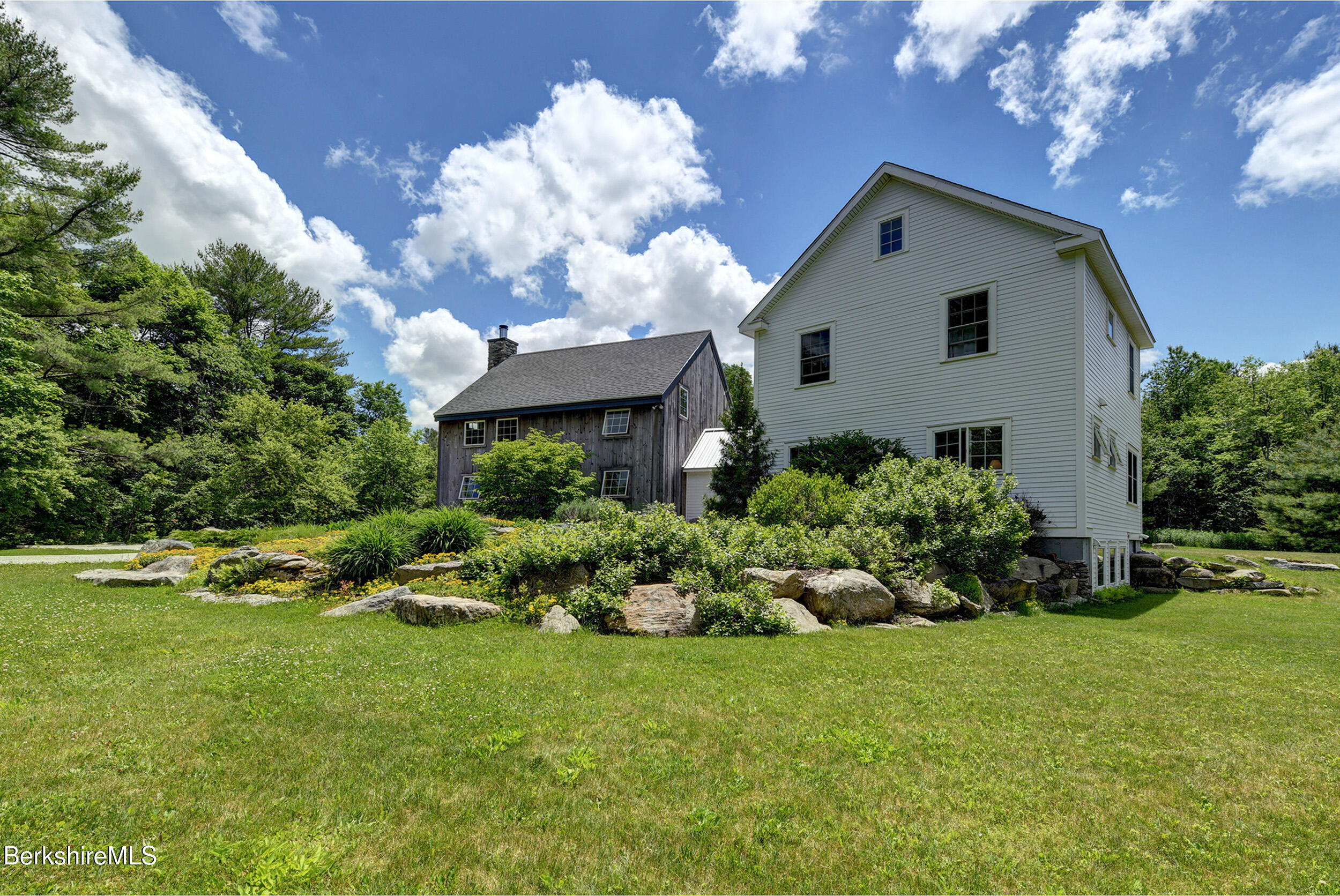 66 Access Road Becket, MA 01223 - Photo 2 of 54 a front view of a house with a yard