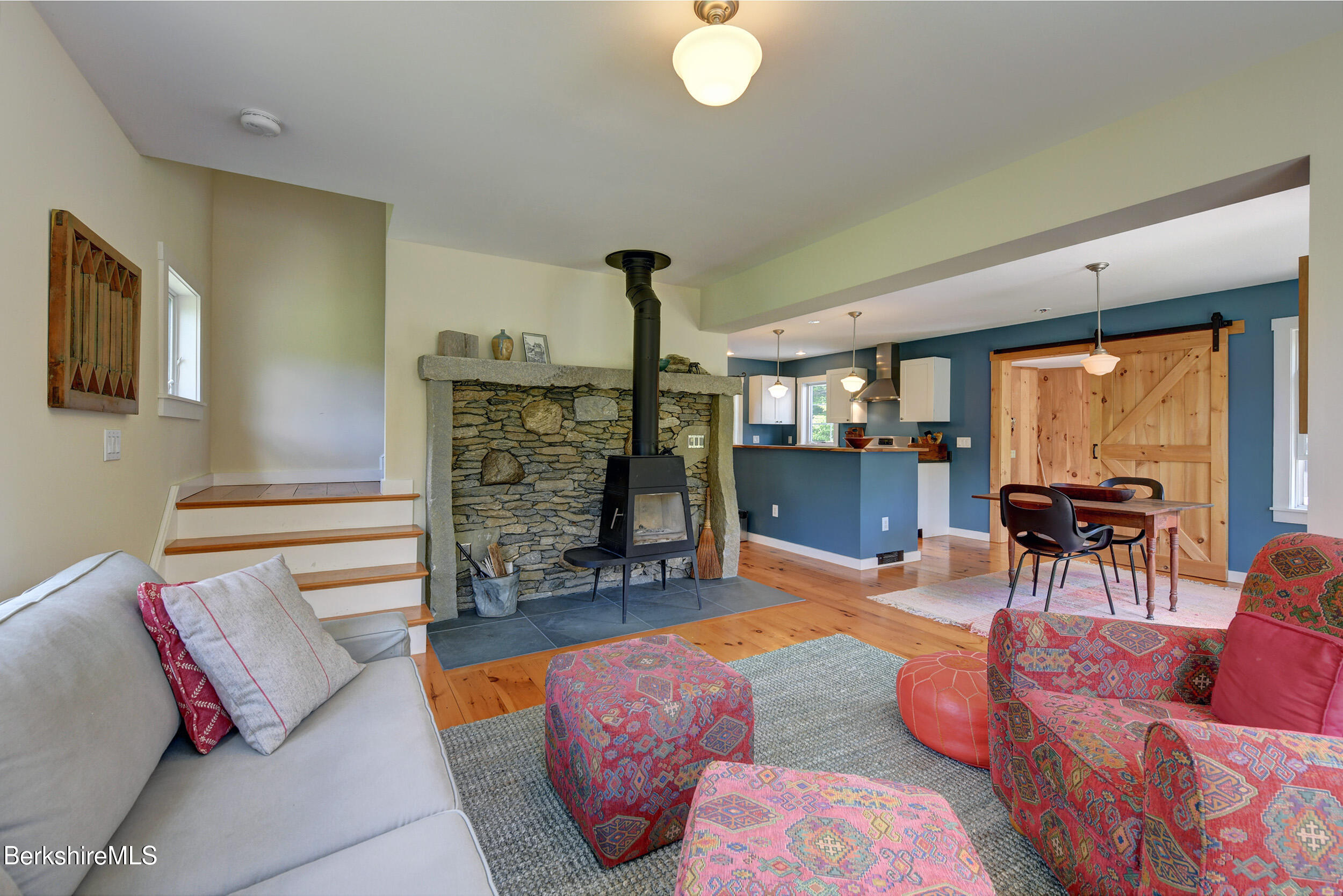 66 Access Road Becket, MA 01223 - Photo 23 of 54 a living room with furniture and a large window