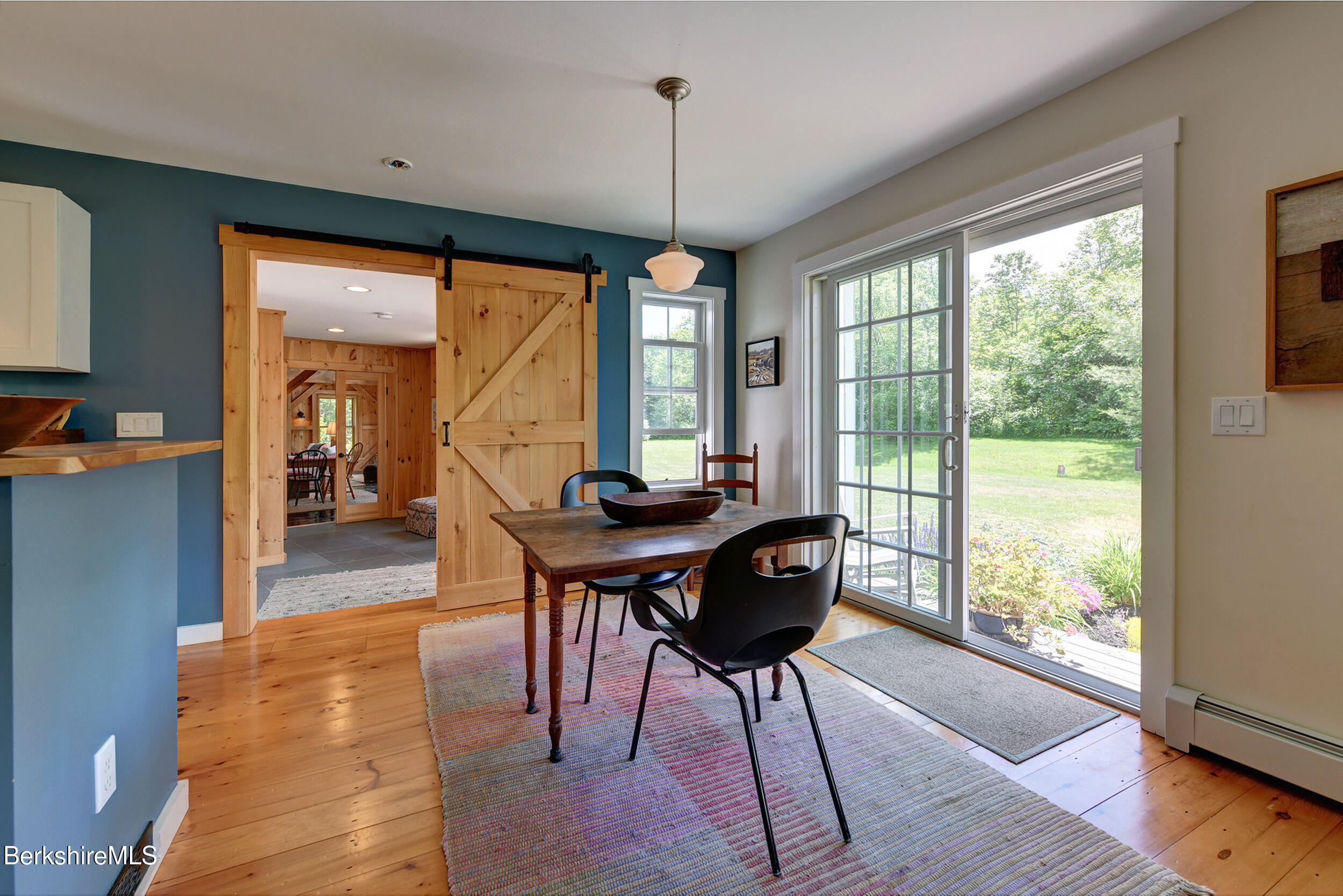66 Access Road Becket, MA 01223 - Photo 24 of 54 a view of a dining room with furniture window and wooden floor