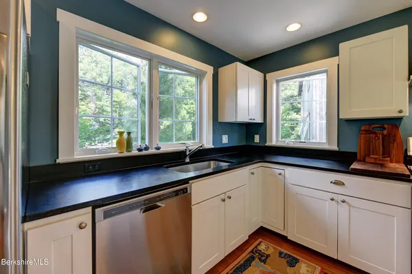 a room with mirror and window