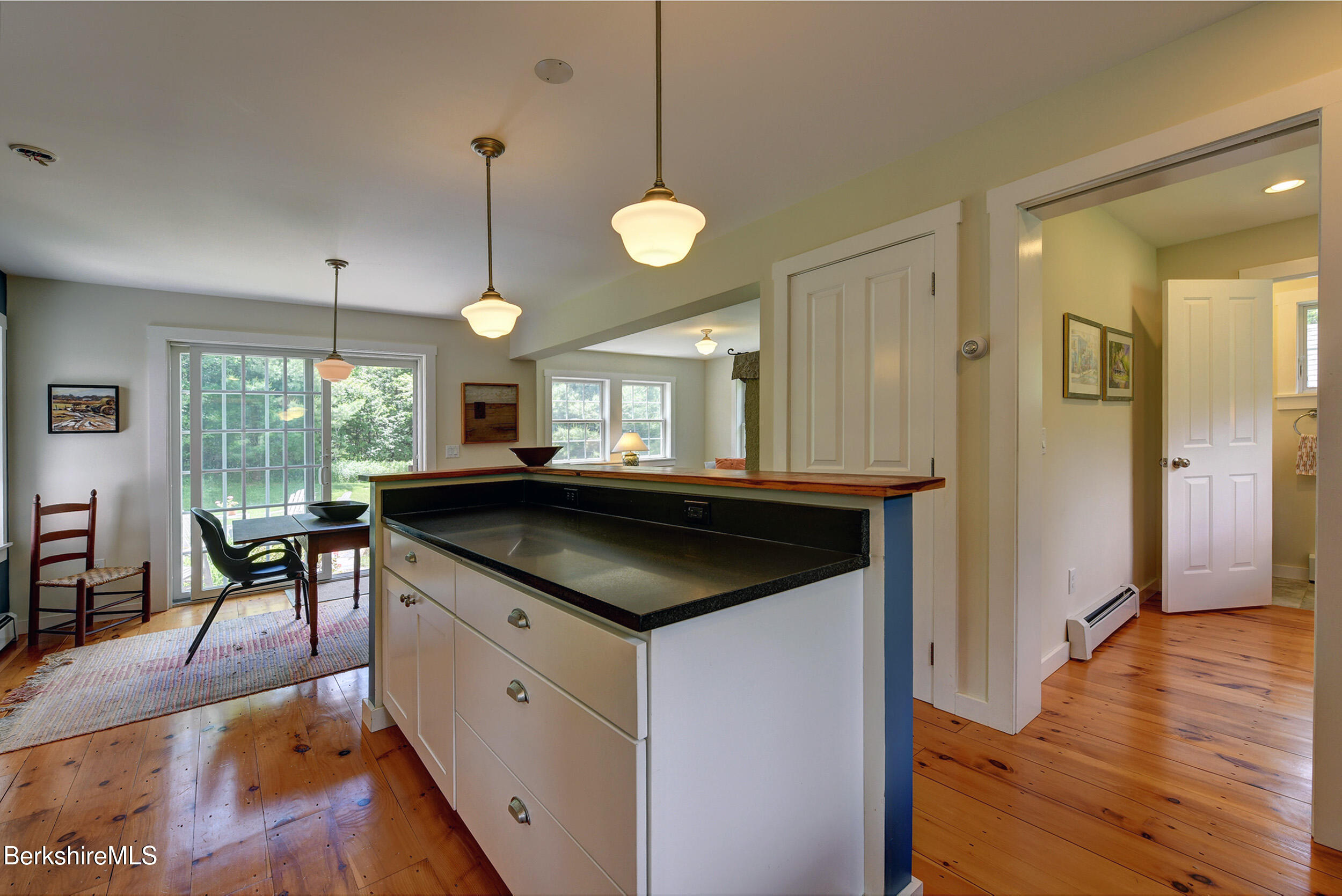 66 Access Road Becket, MA 01223 - Photo 28 of 54 a kitchen with a table and chairs in it