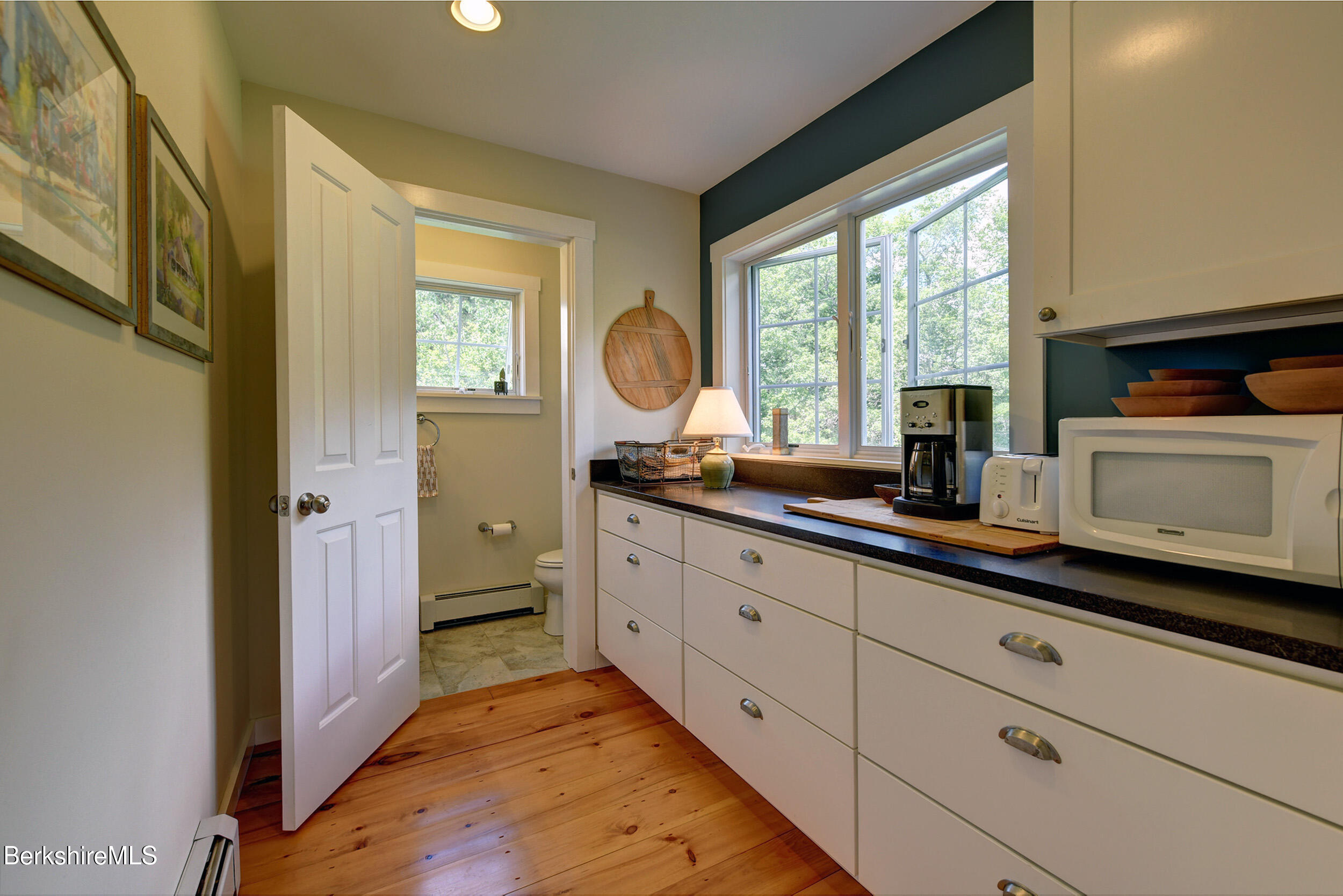 66 Access Road Becket, MA 01223 - Photo 29 of 54 a room with mirror and window