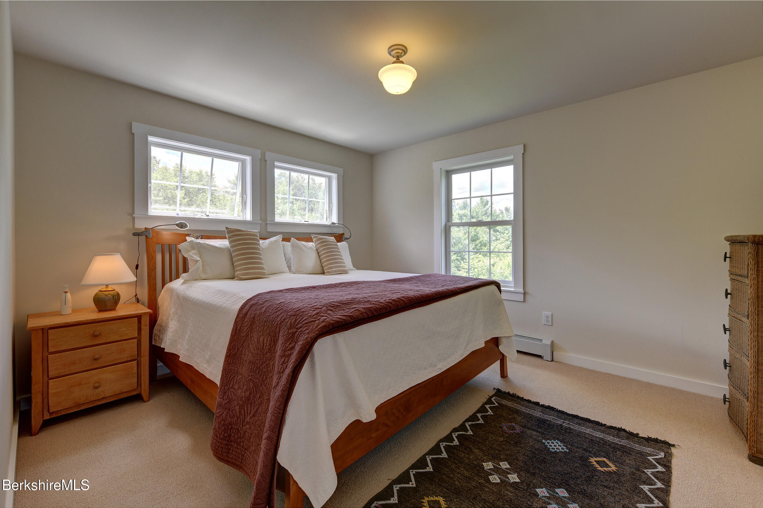 66 Access Road Becket, MA 01223 - Photo 32 of 54 a bed room with a bed and a window