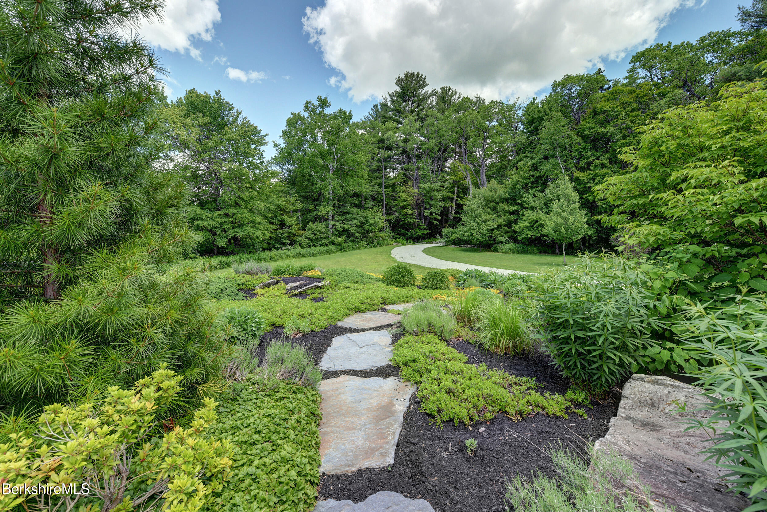 66 Access Road Becket, MA 01223 - Photo 4 of 54 a view of a garden with large trees