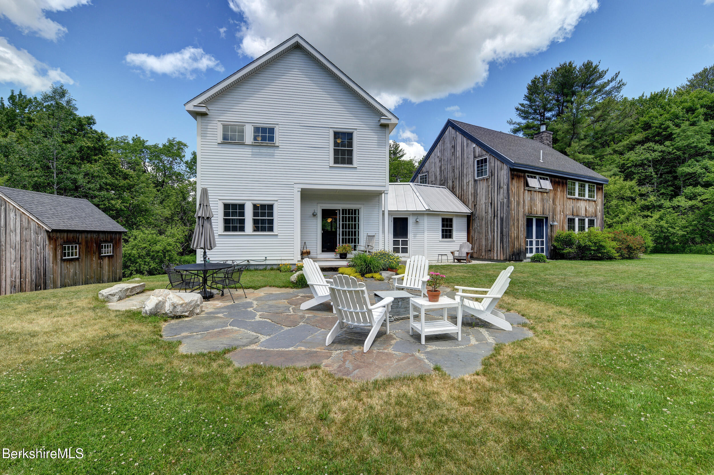 66 Access Road Becket, MA 01223 - Photo 42 of 54 a view of a house with a patio