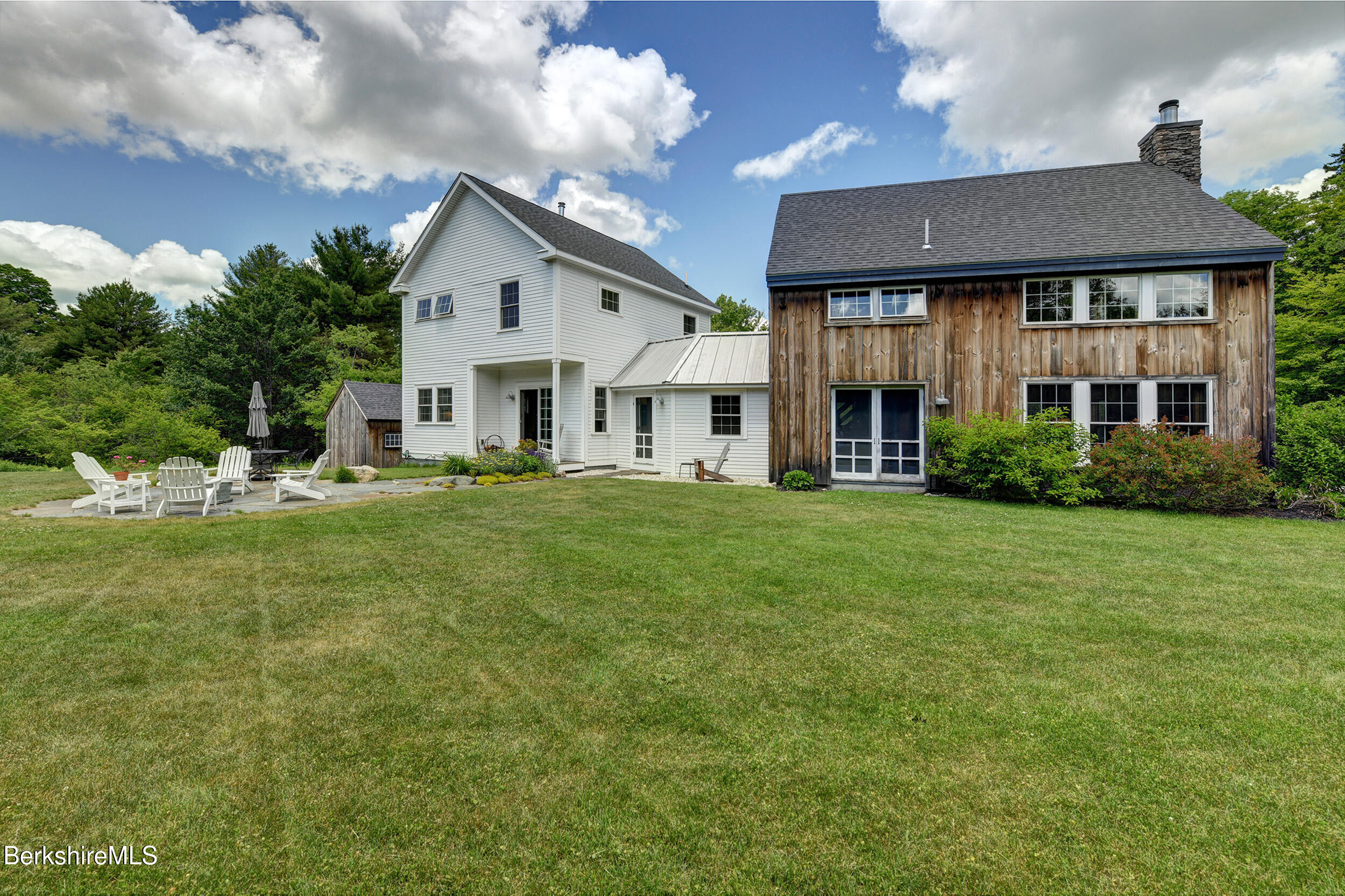 66 Access Road Becket, MA 01223 - Photo 43 of 54 a front view of a house with a yard