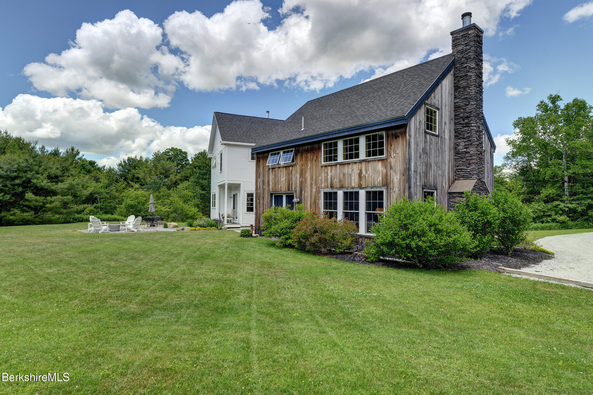 66 Access Road Becket, MA 01223 - Photo 44 of 54 a front view of a house with garden