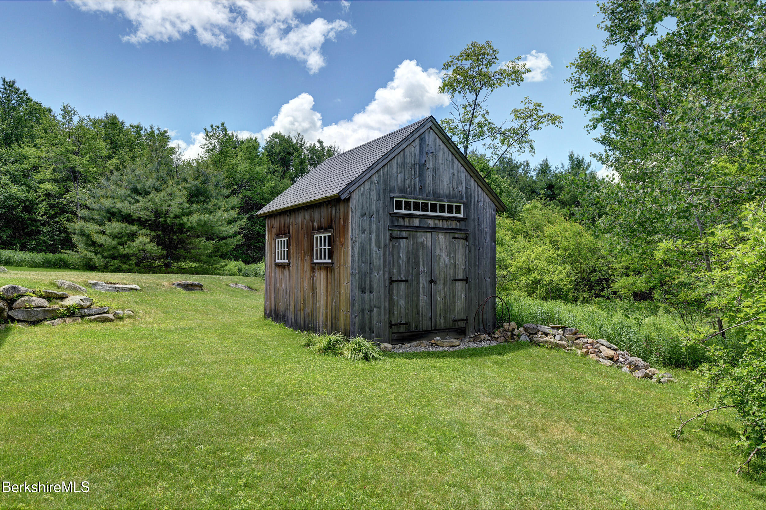 66 Access Road Becket, MA 01223 - Photo 48 of 54 a view of a house with a yard