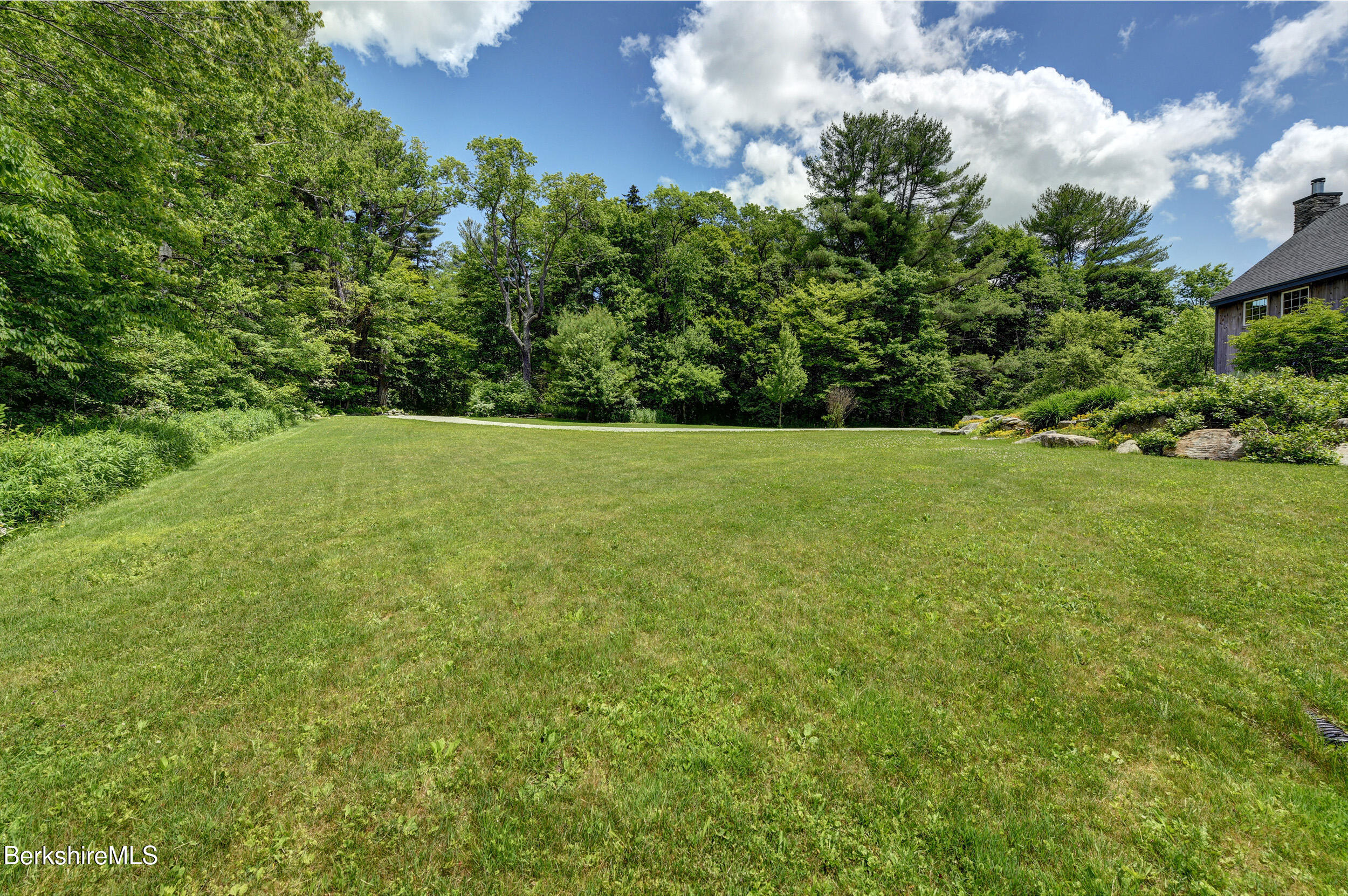 66 Access Road Becket, MA 01223 - Photo 5 of 54 a view of an outdoor space and a yard