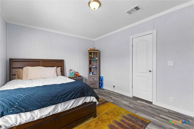 a bathroom with a sink a toilet and shower curtain