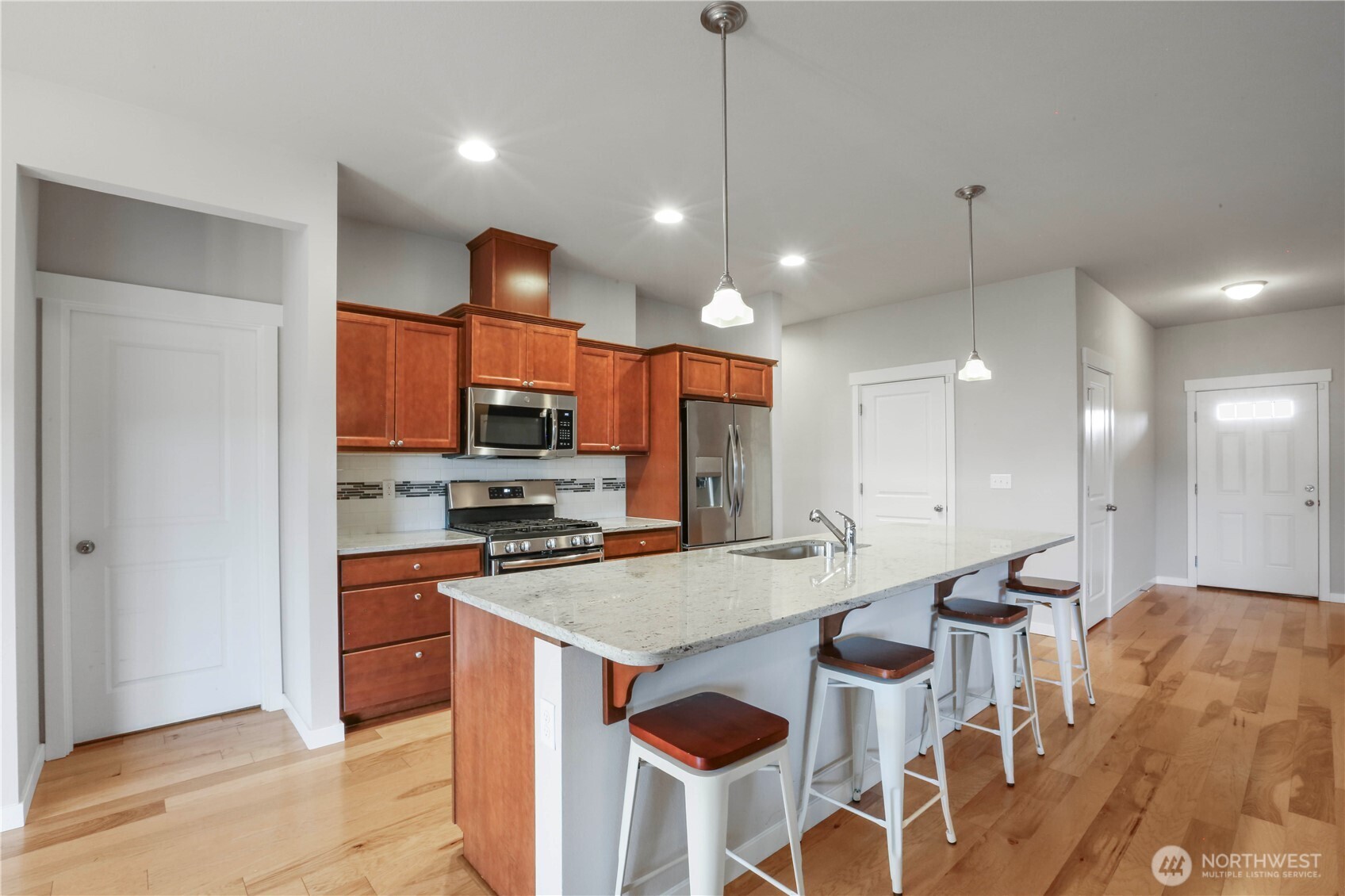 4192 McLaughlin Road Mount Vernon, WA 98273 - Photo 16 of 40 a kitchen with stainless steel appliances granite countertop a stove a sink and a refrigerator