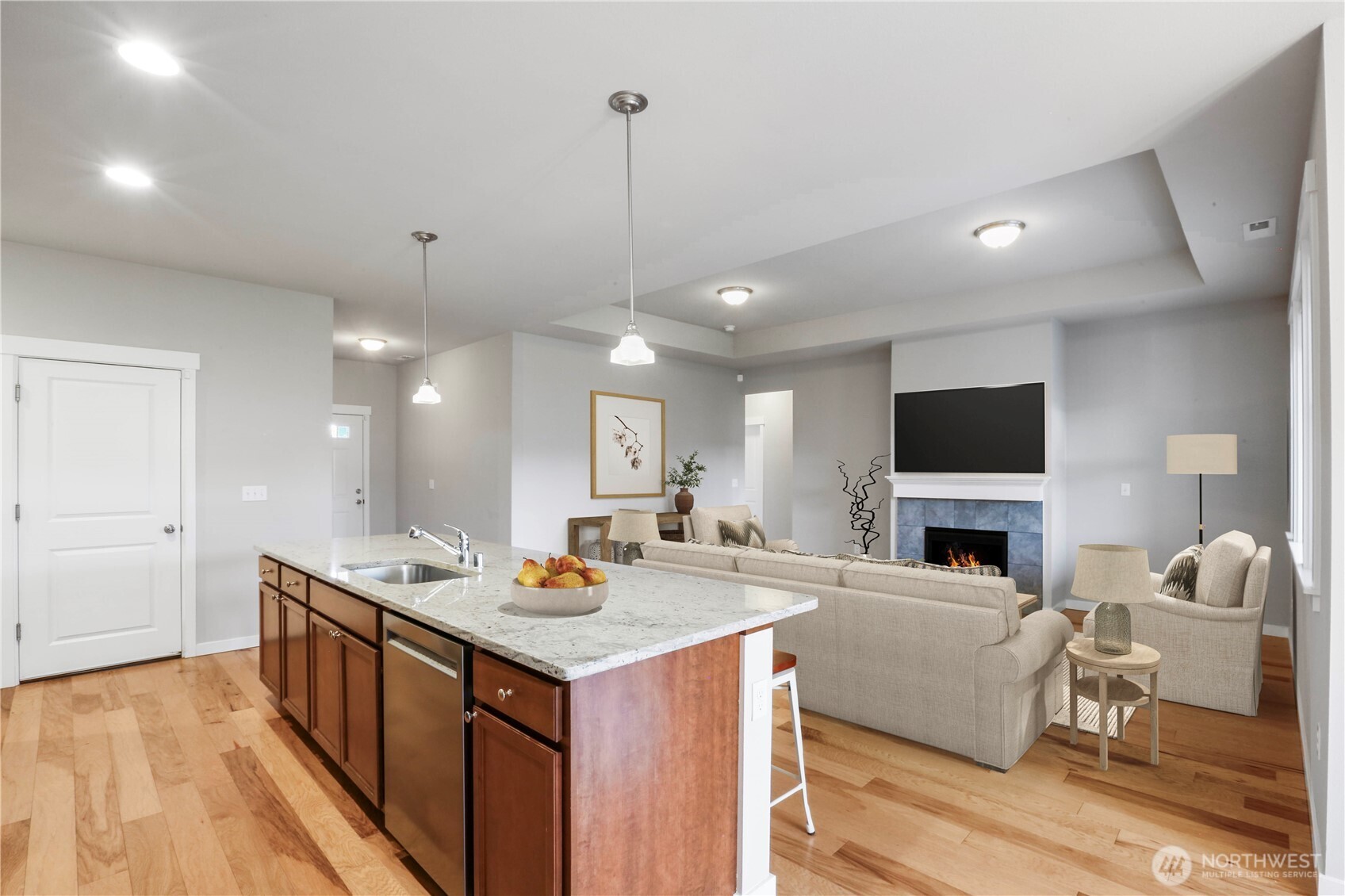 4192 McLaughlin Road Mount Vernon, WA 98273 - Photo 18 of 40 a living room with stainless steel appliances kitchen island granite countertop furniture a fireplace and a flat screen tv