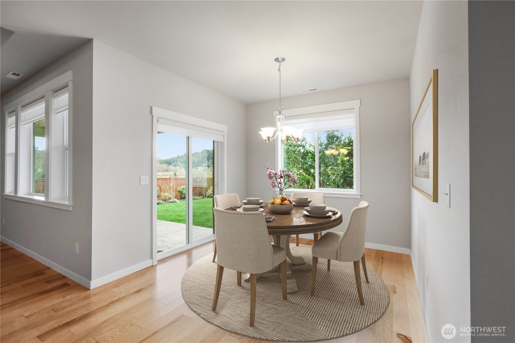 4192 McLaughlin Road Mount Vernon, WA 98273 - Photo 19 of 40 a dining room with furniture a chandelier and wooden floor