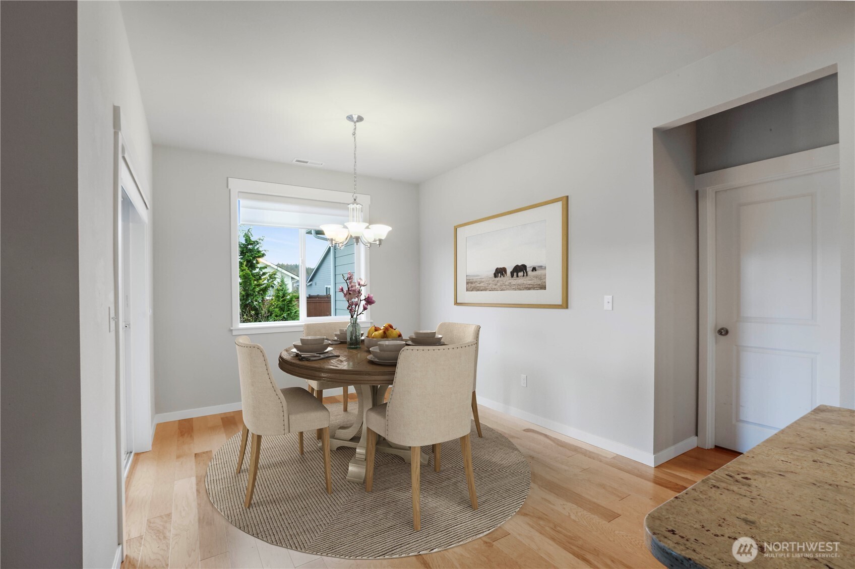 4192 McLaughlin Road Mount Vernon, WA 98273 - Photo 21 of 40 a view of a dining room with furniture and wooden floor