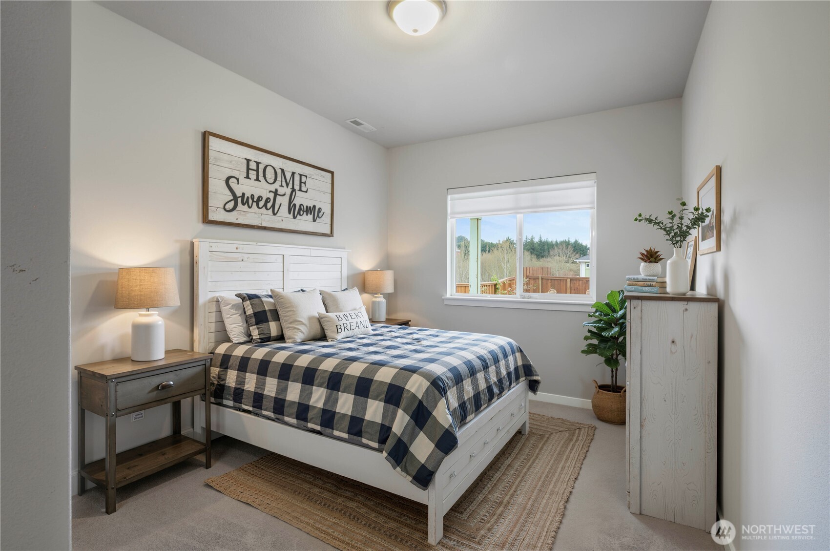 4192 McLaughlin Road Mount Vernon, WA 98273 - Photo 23 of 40 a bedroom with a bed a window and potted plant
