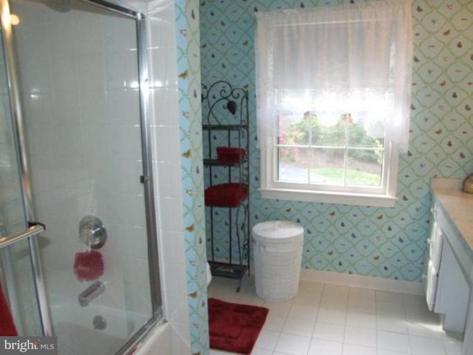 12409 Over Ridge Road Potomac, MD 20854 - Photo 12 of 30 a bathroom with a toilet and a shower