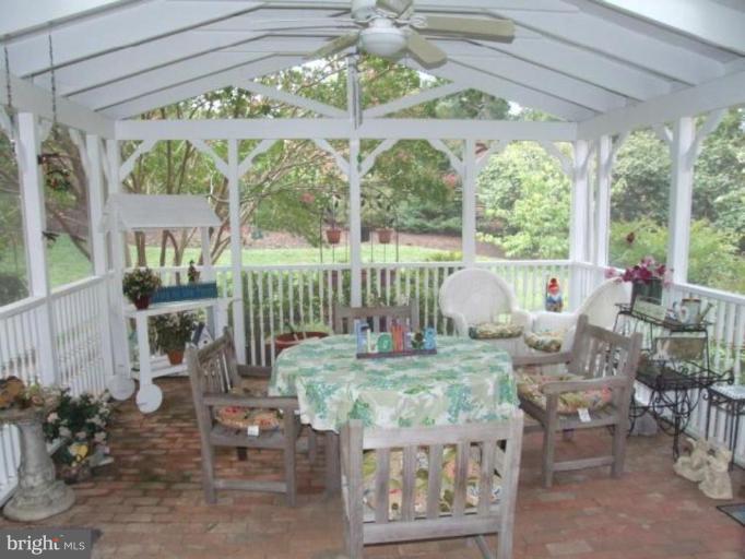 12409 Over Ridge Road Potomac, MD 20854 - Photo 23 of 30 a living room with patio furniture and a large window
