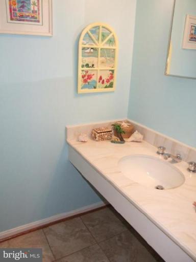12409 Over Ridge Road Potomac, MD 20854 - Photo 25 of 30 a bathroom with a sink and a window