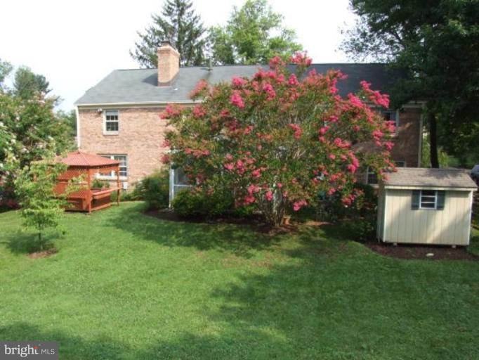 12409 Over Ridge Road Potomac, MD 20854 - Photo 26 of 30 a front view of a house with garden