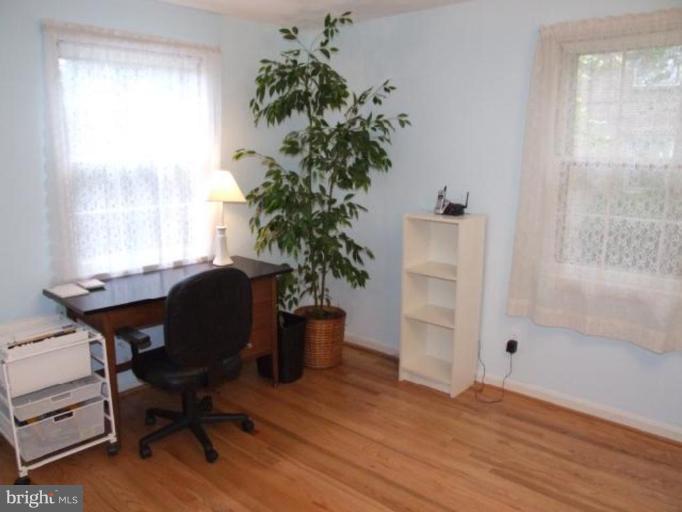 12409 Over Ridge Road Potomac, MD 20854 - Photo 28 of 30 a view of a workspace room with wooden floor and a window