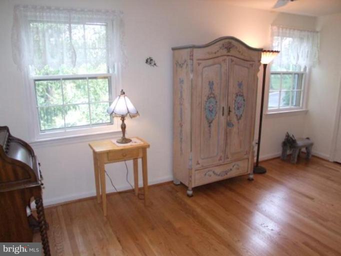 12409 Over Ridge Road Potomac, MD 20854 - Photo 6 of 30 a view of a livingroom with wooden floor and a window