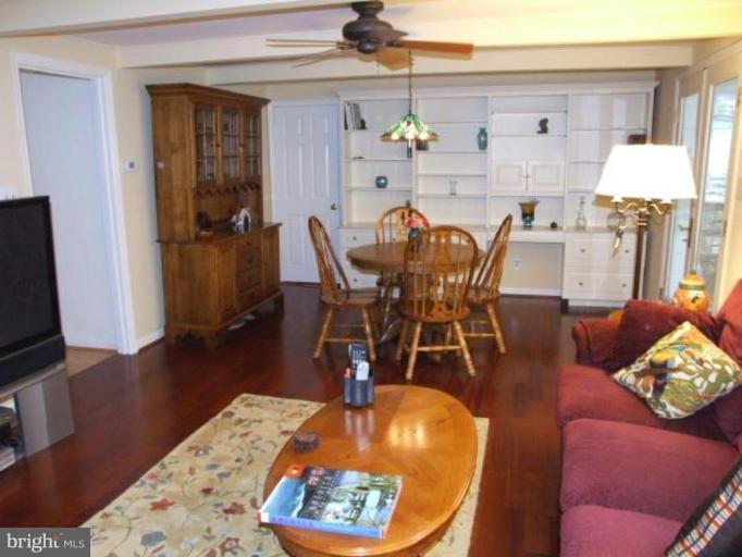 12409 Over Ridge Road Potomac, MD 20854 - Photo 10 of 30 a dining room with furniture and wooden floor