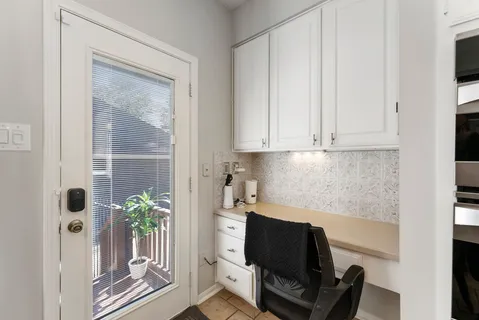 a room with furniture and a potted plant