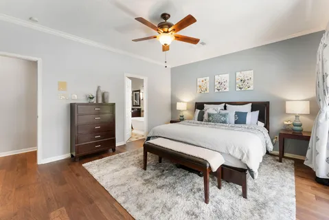 a bedroom with a bed and dresser