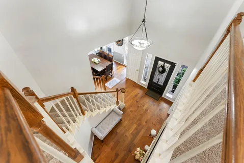 a view of an entryway with wooden floor