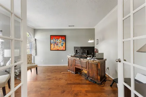 a view of a workspace with furniture and a kitchen