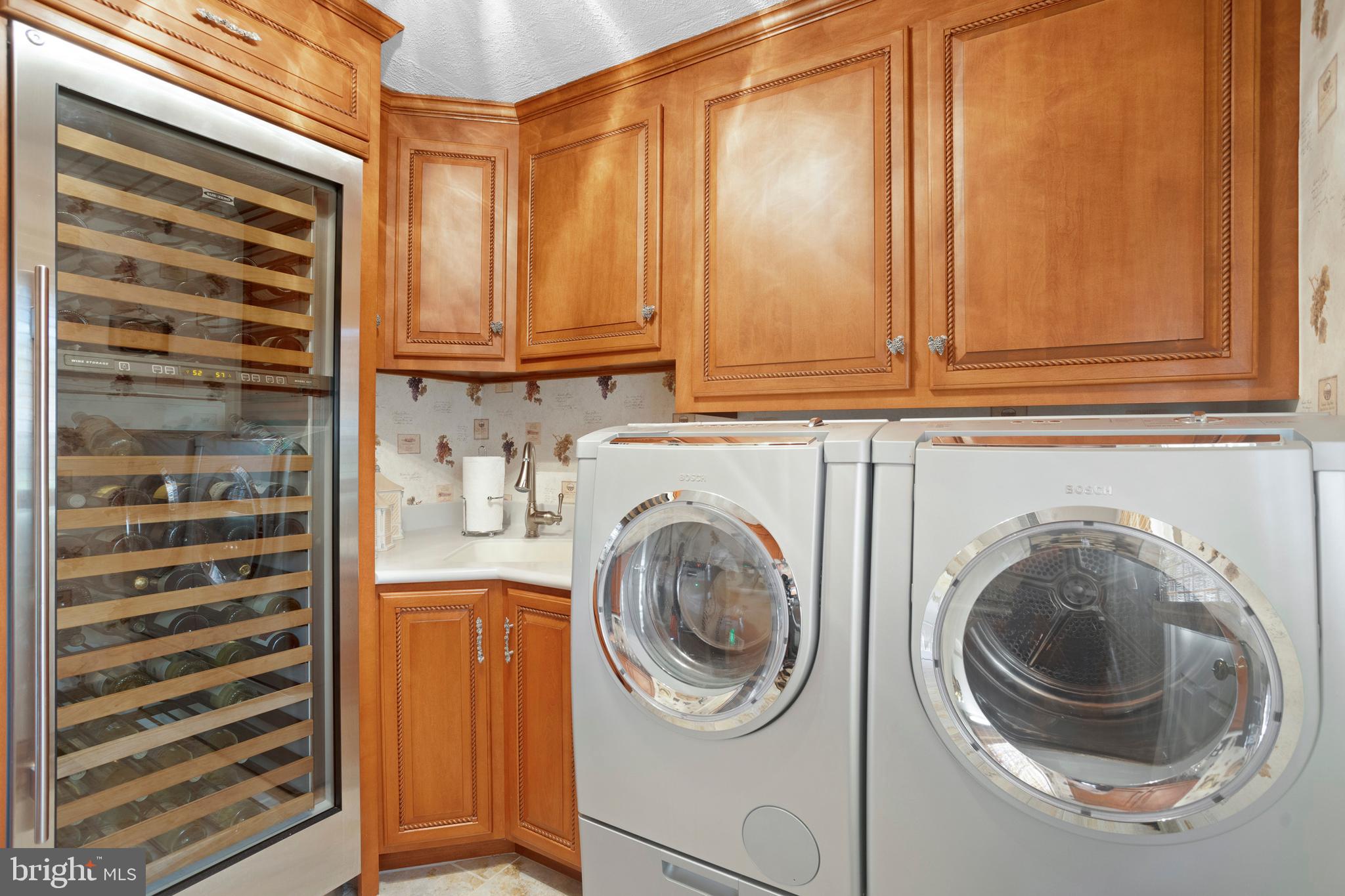 910 Morris Road Blue Bell, PA 19422 - Photo 26 of 56 Laundry Room with Wine Fridge