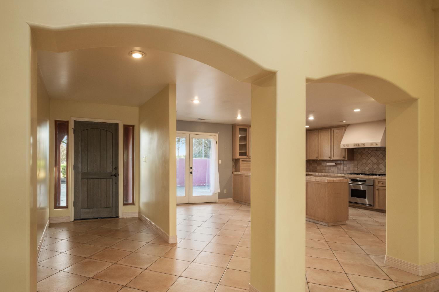 19282 East South Avenue Reedley, CA 93654 - Photo 13 of 33 a view of a kitchen and a refrigerator in a kitchen
